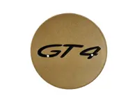 Radkappe - "GT4" Logo - In Aurum Hochglanz. Porsche 718 (982) Cayman GT4